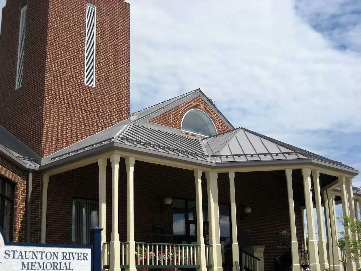 Skilled roofing craftsmen working on a residential roof in Crownsville